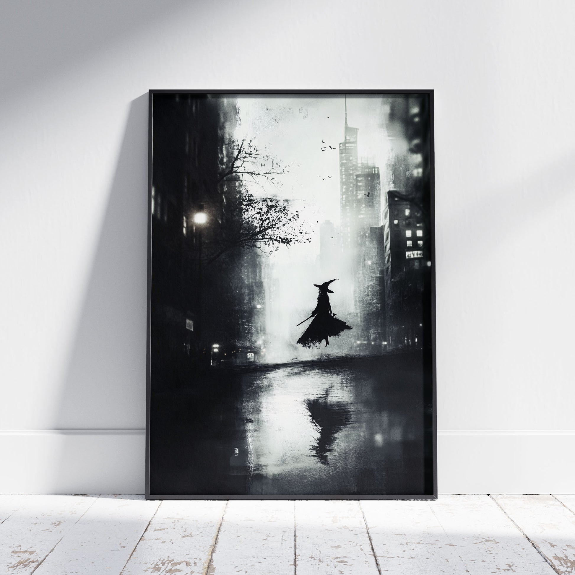 A moody, black and white digital painting of a witch's silhouette levitating in the middle of a rainy, modern city street. The witch wears a pointed hat and holds a staff, her reflection visible on the wet pavement below. Towering skyscrapers loom in the background under a hazy sky.