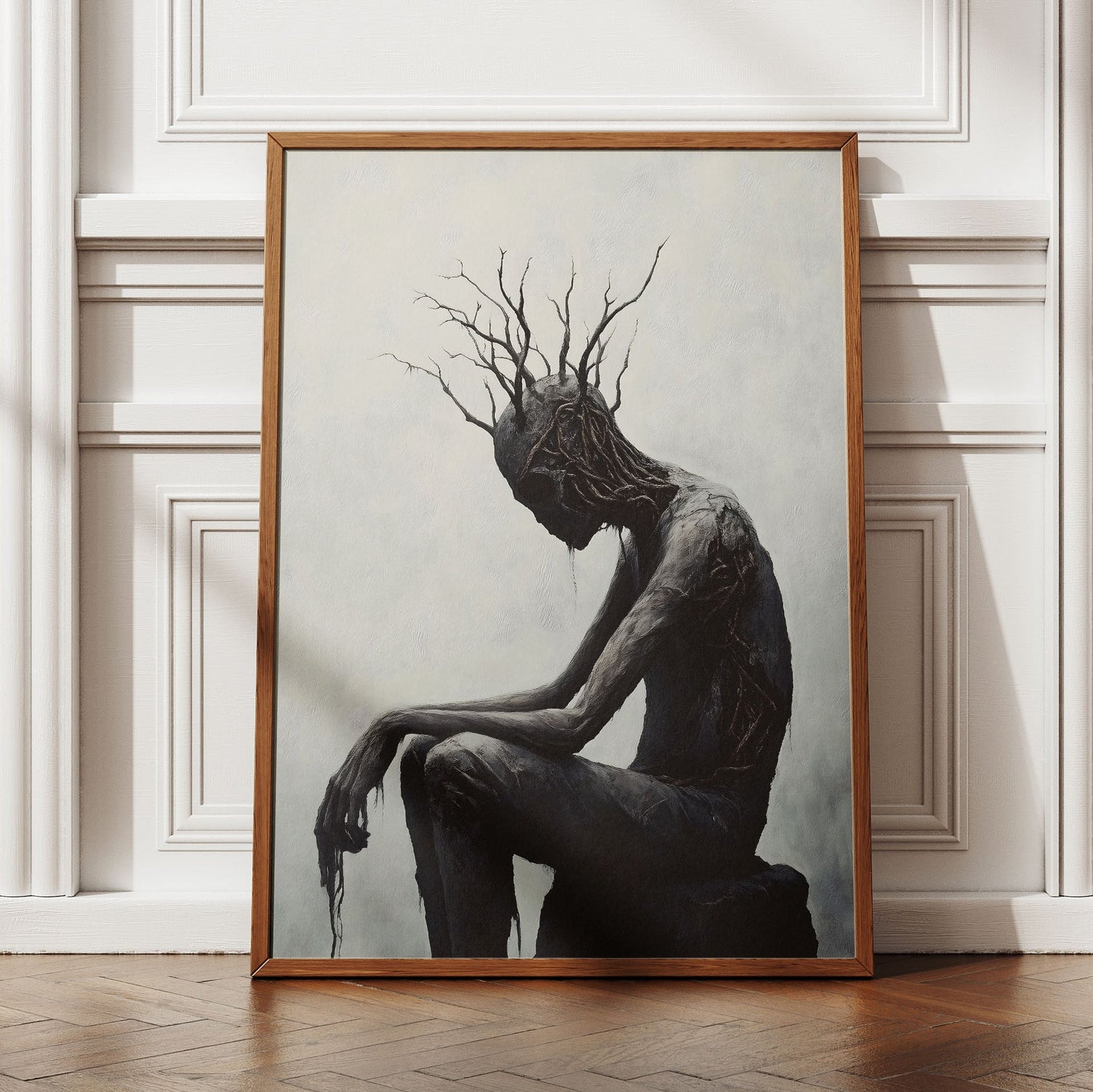 Framed black and white gothic art print of a seated tree man figure with branch antlers, from Turtlebite