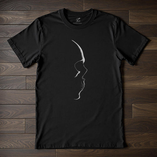 Black t-shirt with white skull silhouette design on wooden floor