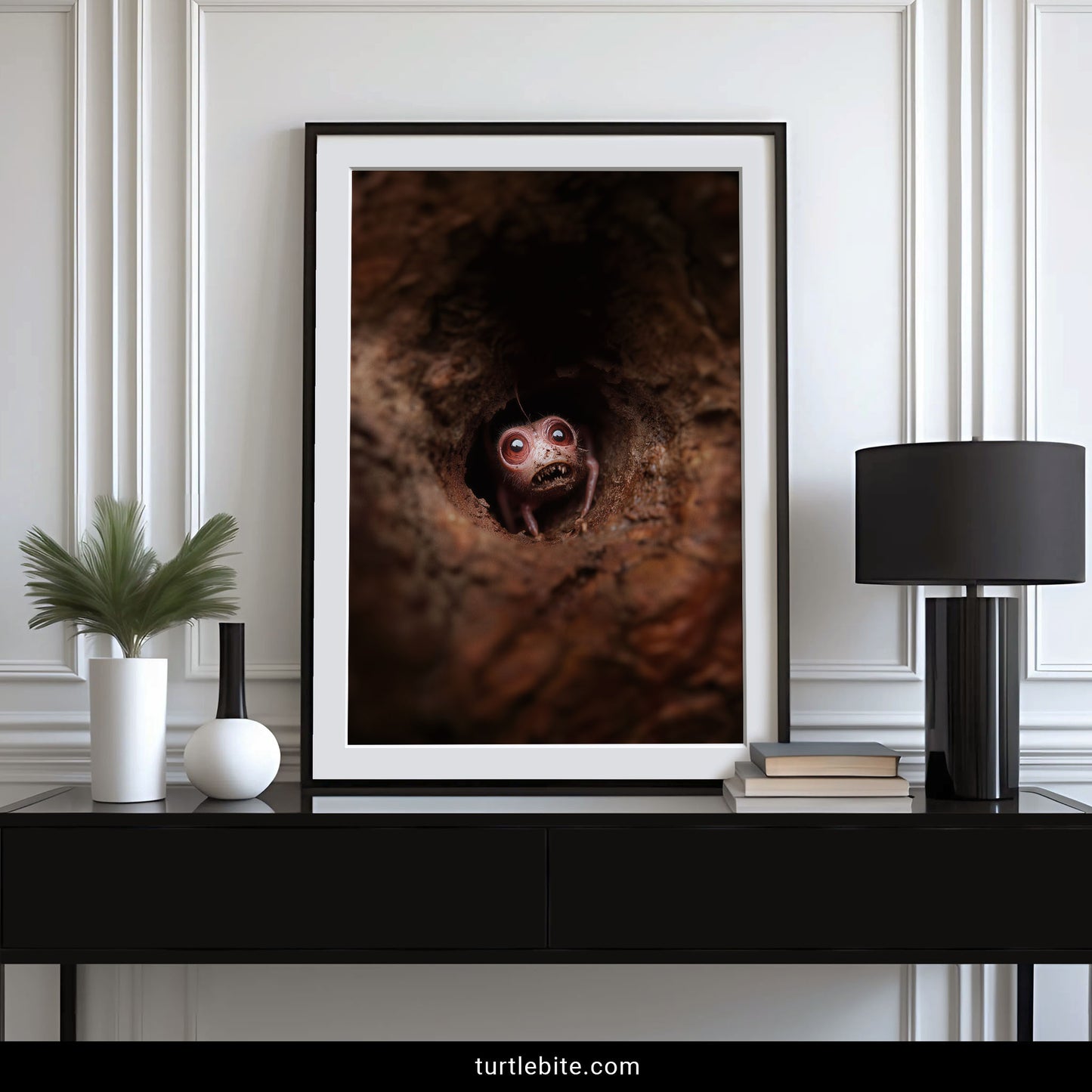 Detail shot of creepy cute monster art print, textured soil and warm spotlight glow