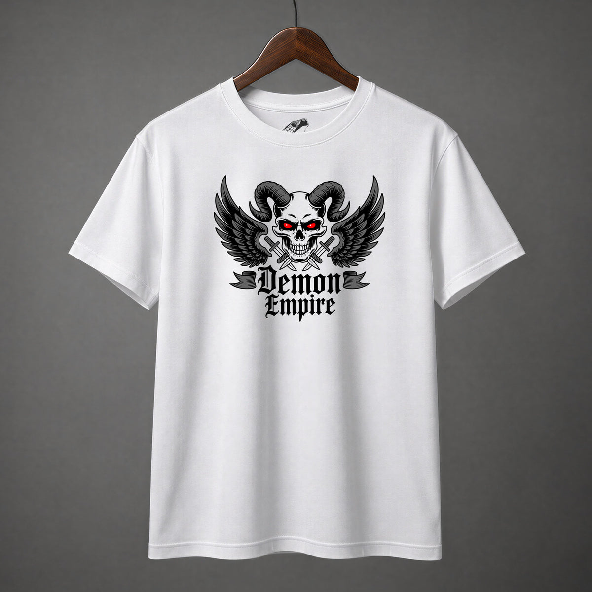 Demon skull shirt design featuring ram horns, glowing red eyes, and black wings