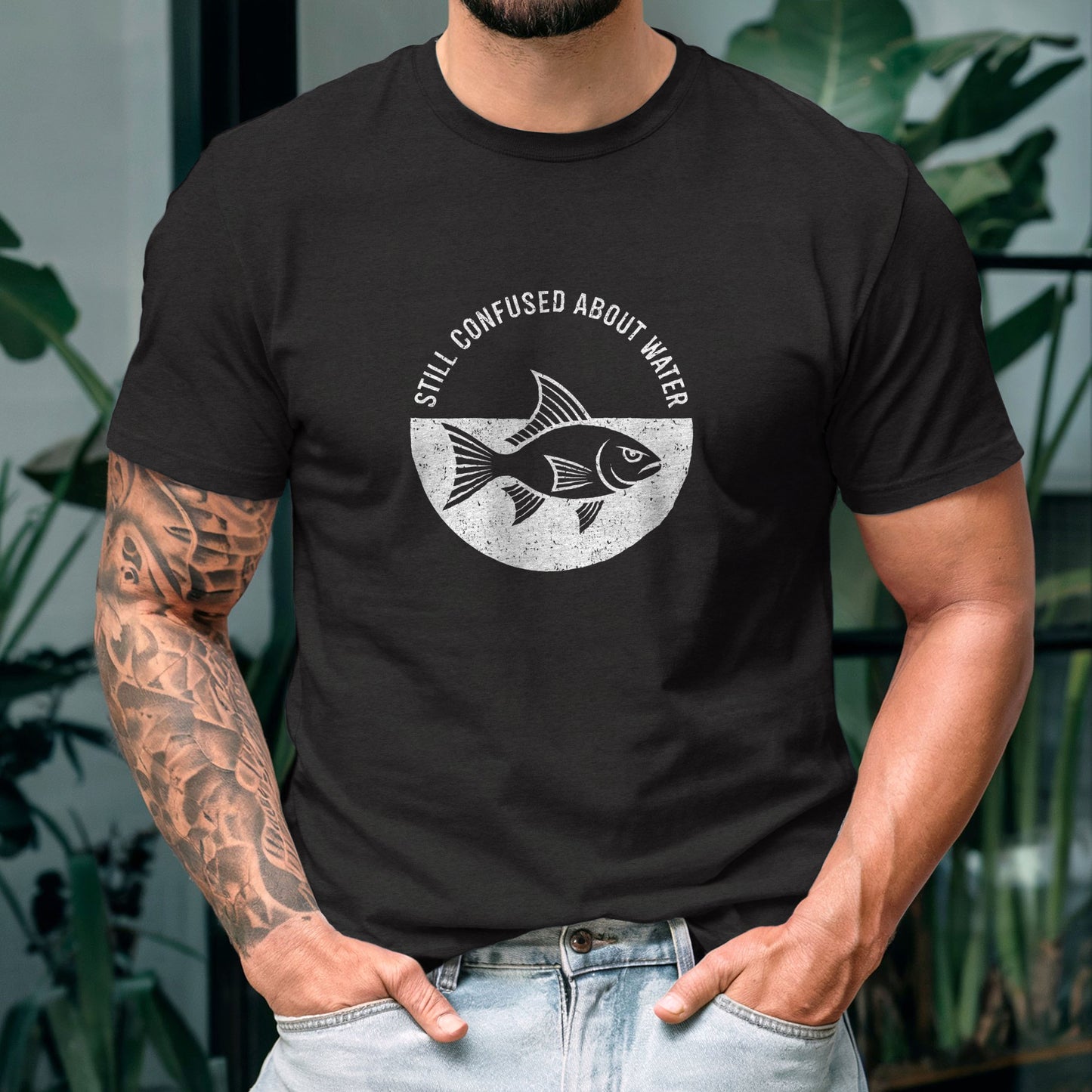 Dark humor graphic tee featuring fish design with sarcastic oxymoron statement about water confusion