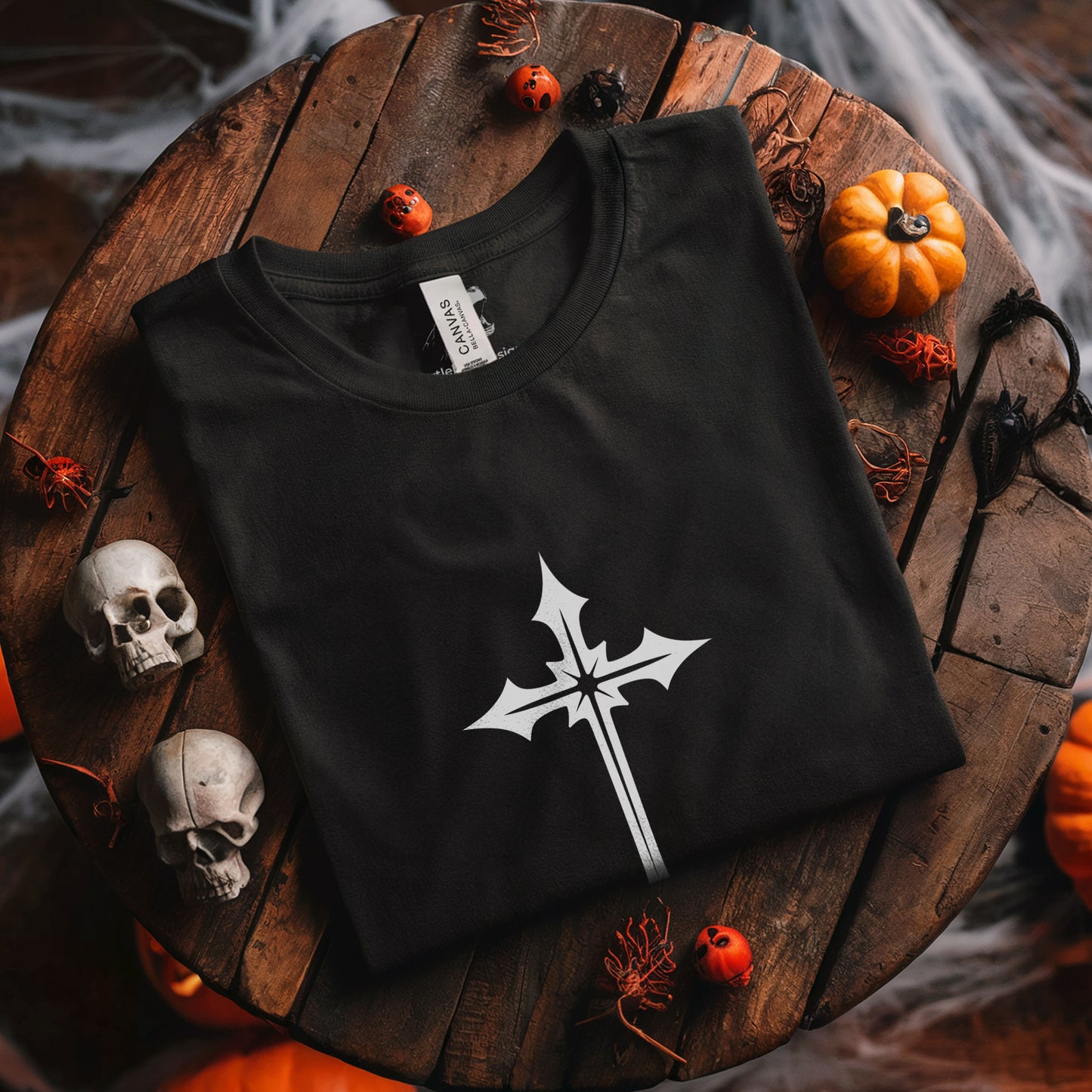 Gothic fashion tee with elegant white cross design on black fabric