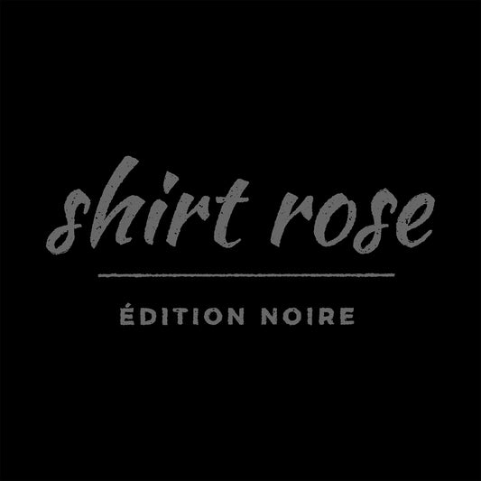 Close-up of cursive gothic text lettering above Édition Noire block type on a dark t-shirt