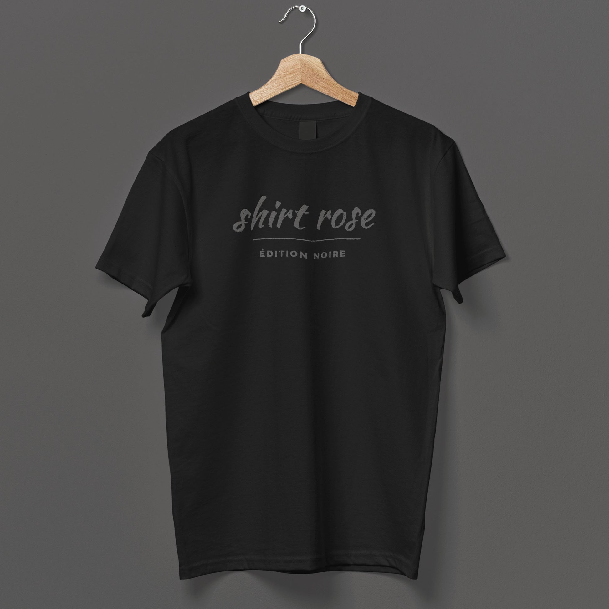 Black gothic streetwear t-shirt featuring French wordplay design, flat lay view