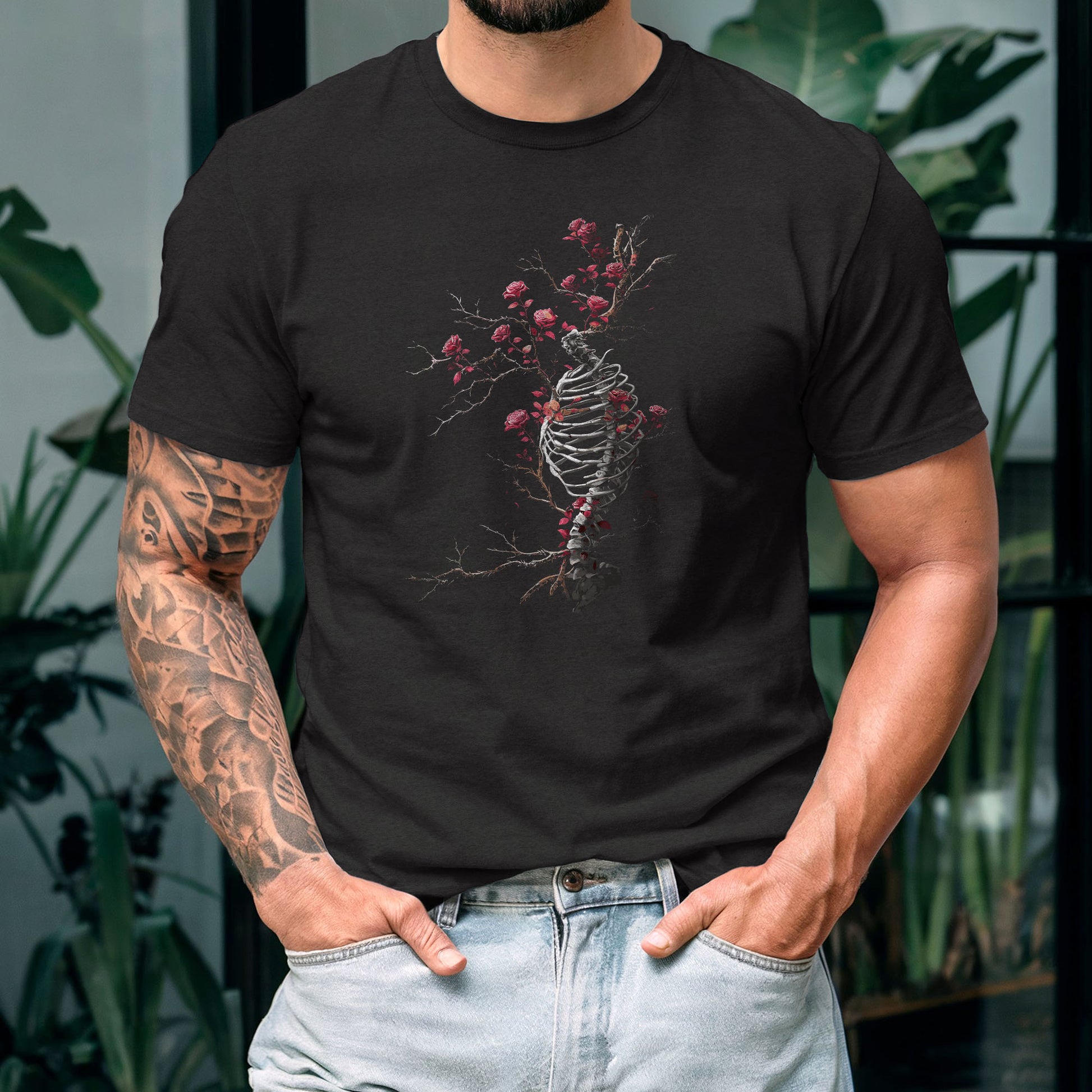 Dark anatomy art tee featuring detailed skeleton ribcage design with crimson rose branches