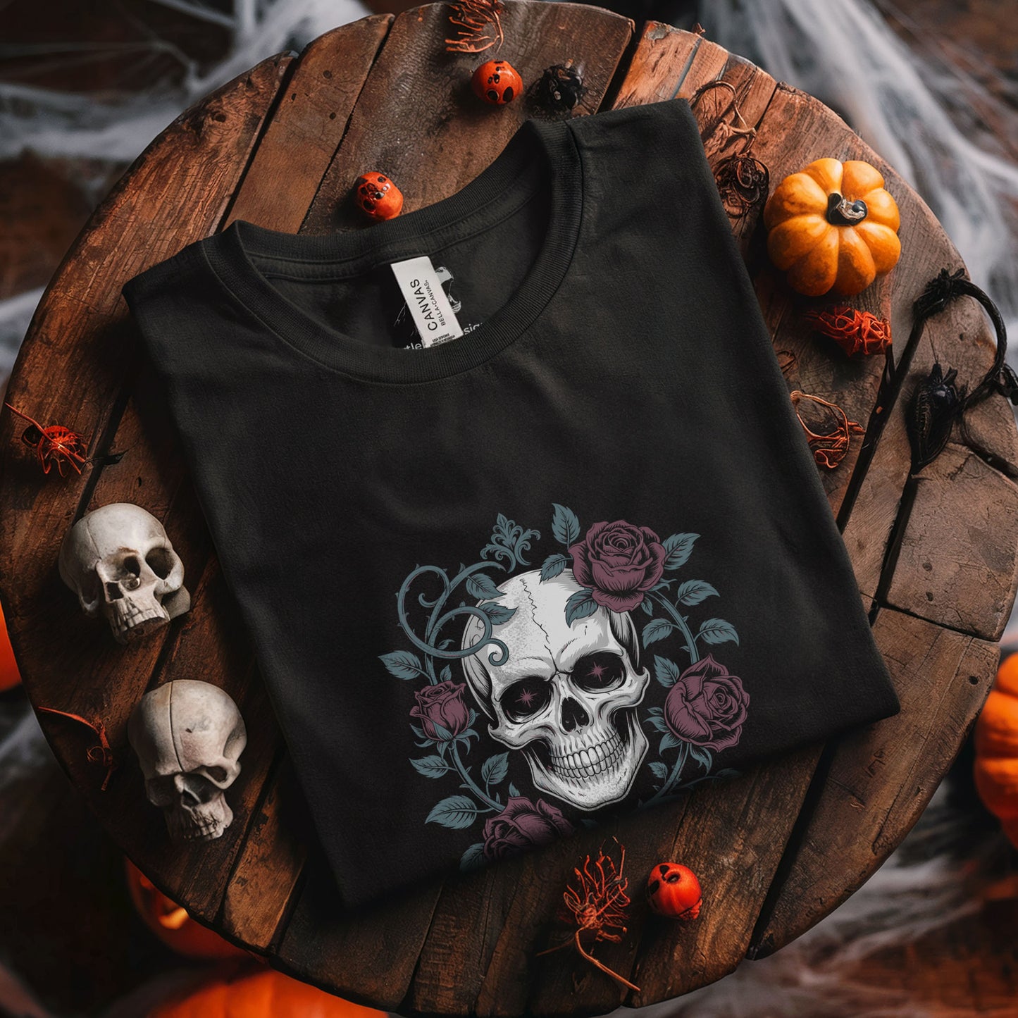Memento mori skull tee featuring burgundy roses and ornate botanical design