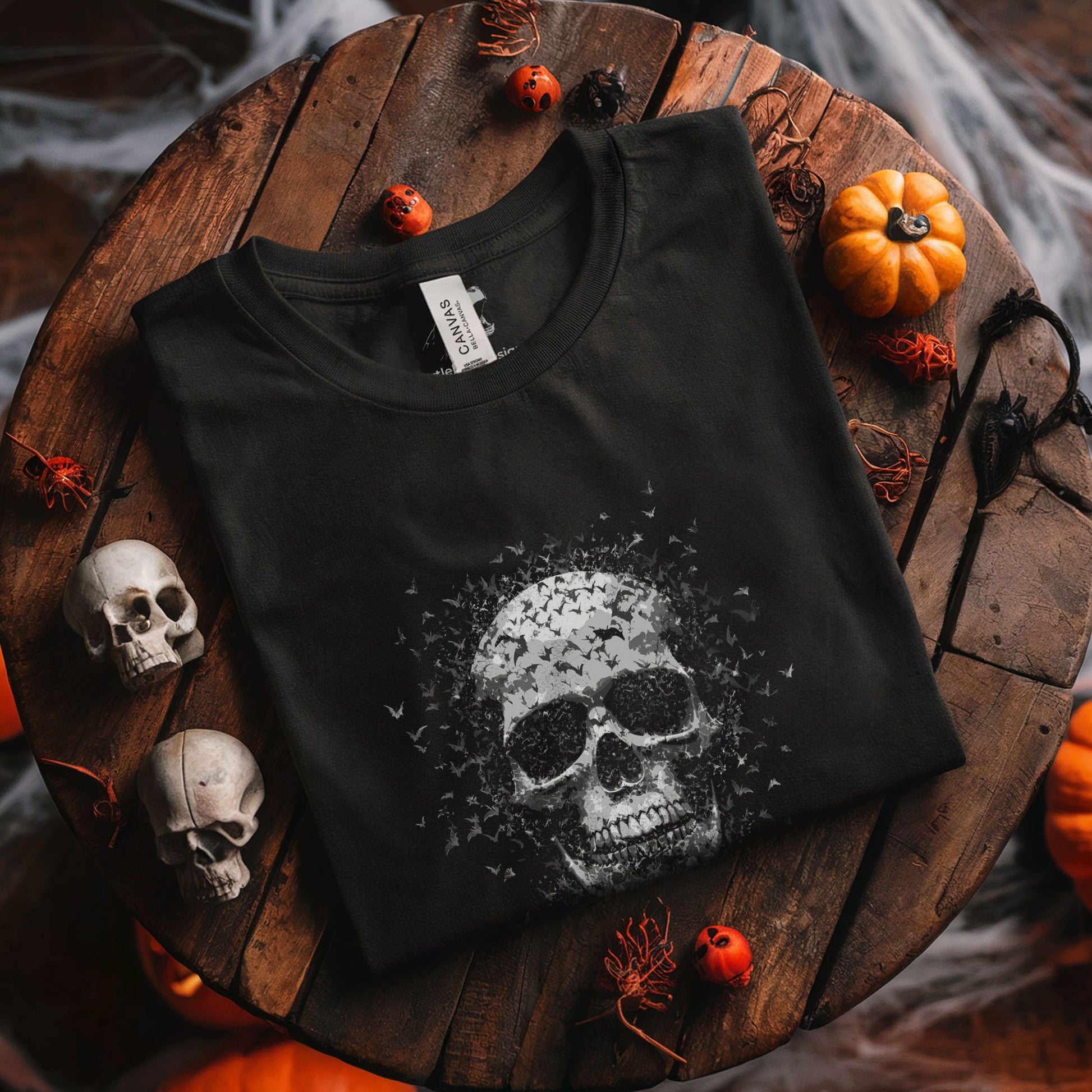 Black gothic tee featuring detailed human skull transforming into swirling bats, dark art clothing