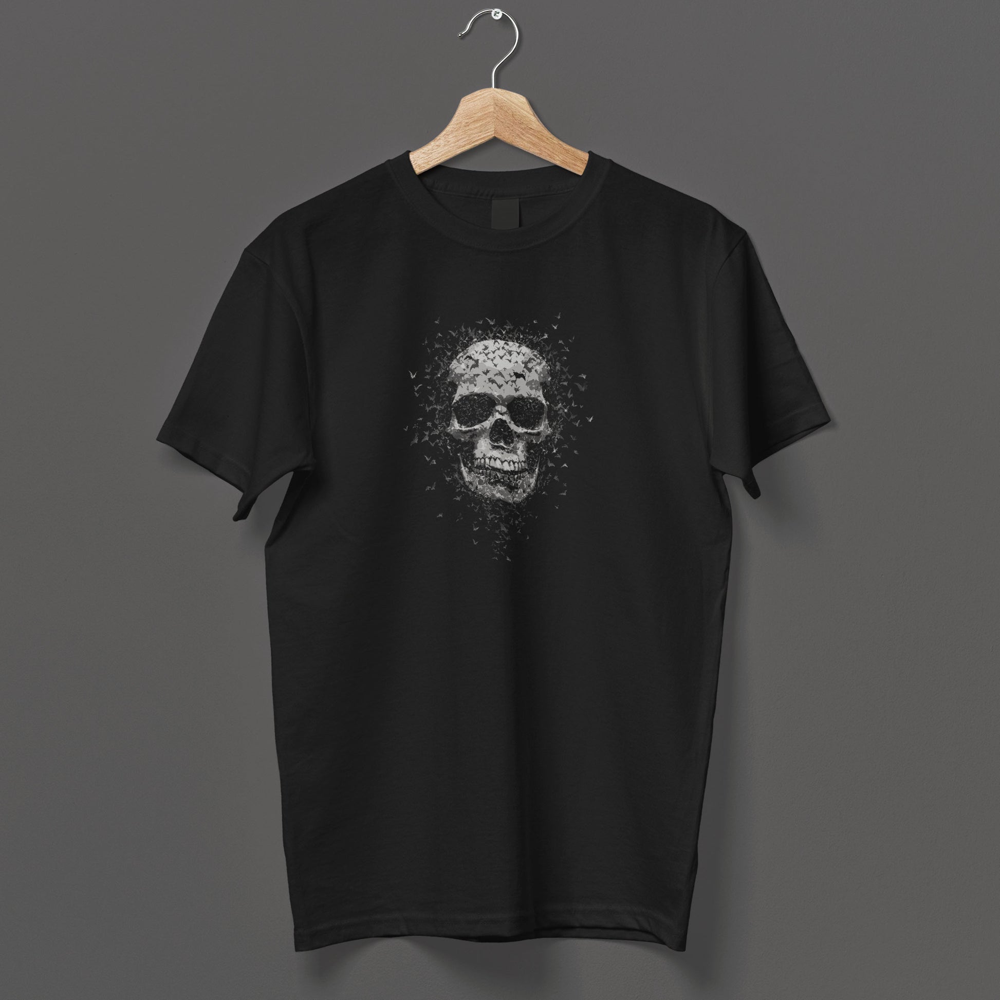 Alternative horror t-shirt with monochrome skull dissolving into bat swarm, gothic apparel