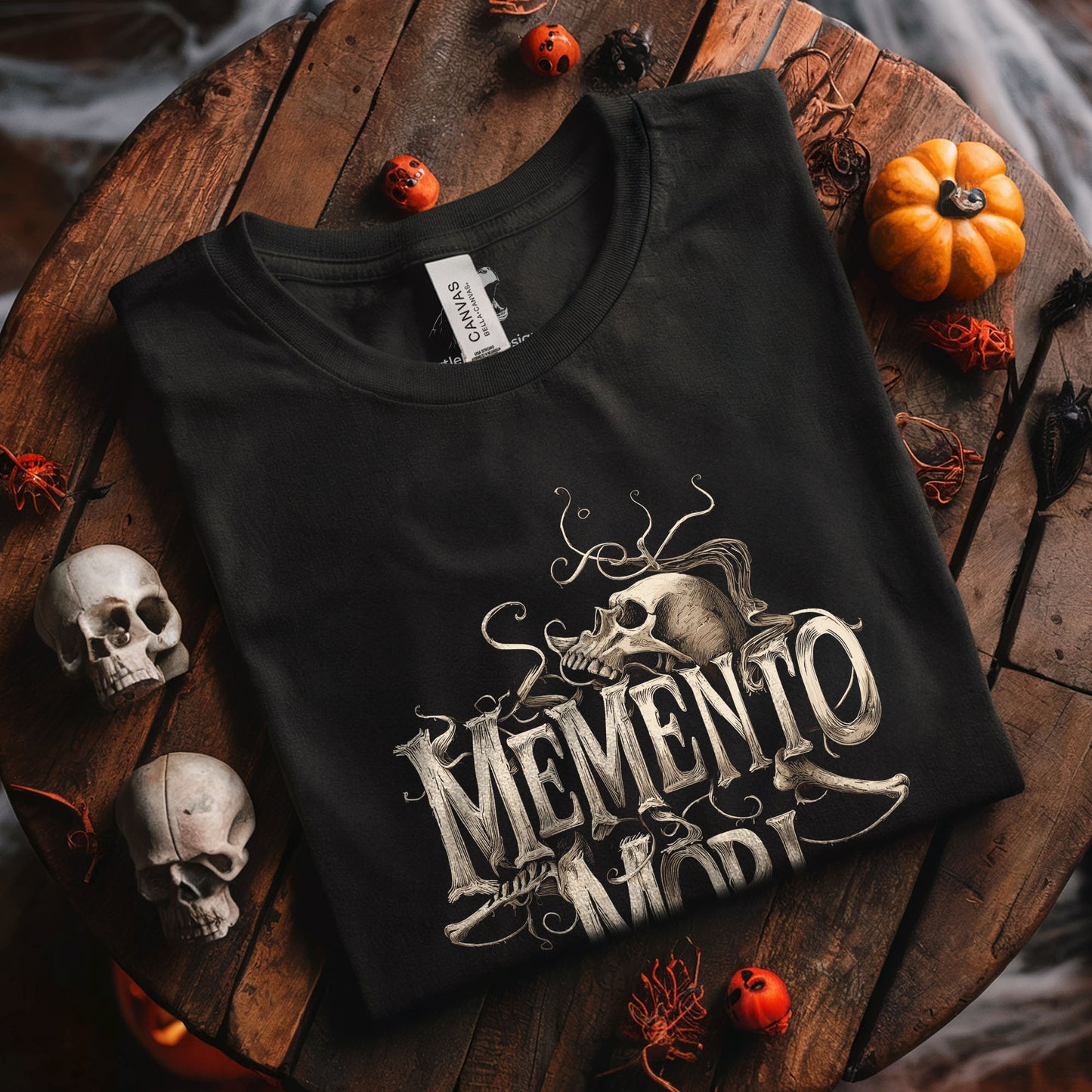 Dark art clothing featuring decorative skull and Latin death reminder phrase
