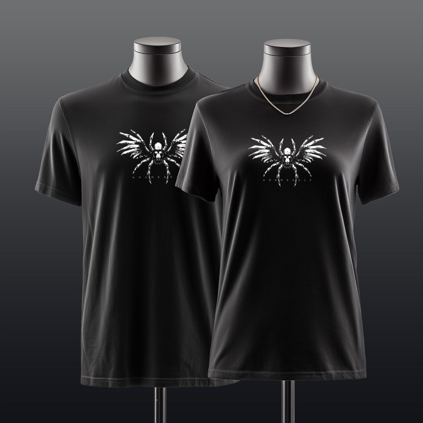 Two black short-sleeve crewneck t-shirts displayed on mannequin torsos against a dark gray gradient background. Both shirts feature a white graphic of a winged spider on the chest.