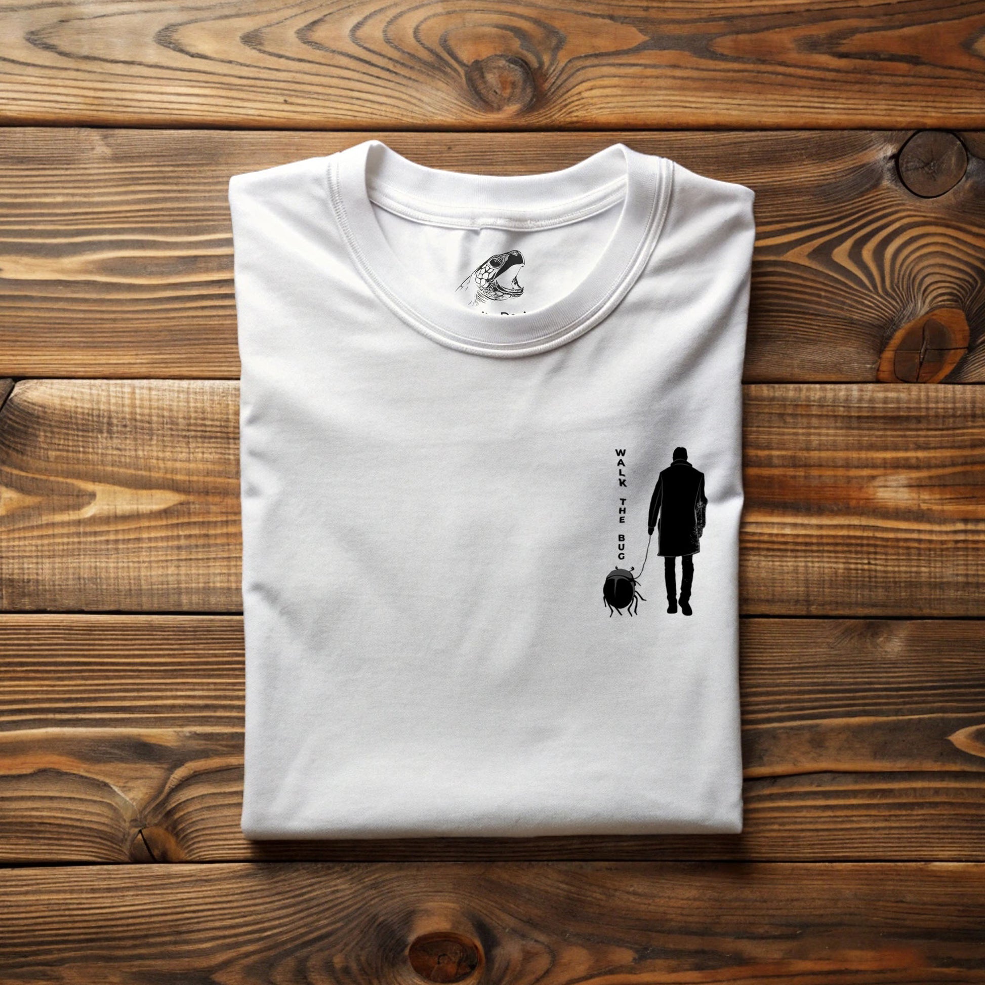 Gothic graphic tee featuring dark surreal beetle-walking illustration